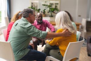 people support each other in an alcohol addiction rehab program